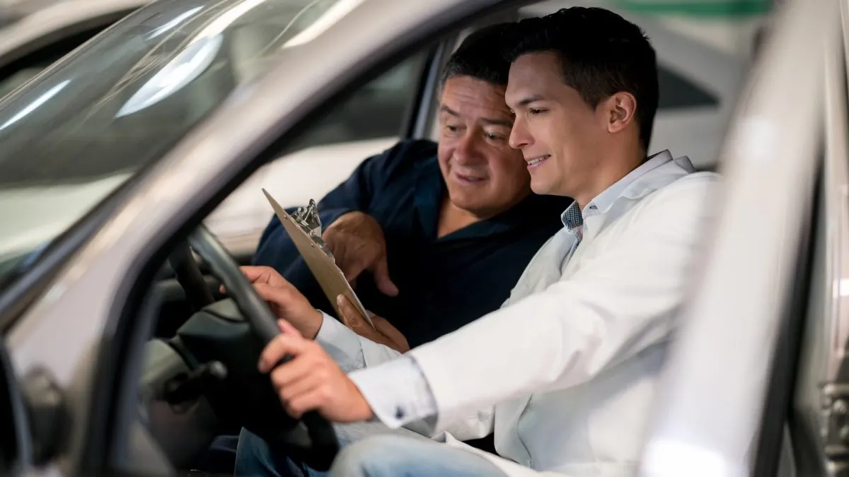 Technician walking a driver through the interlock device at an installation appointment.